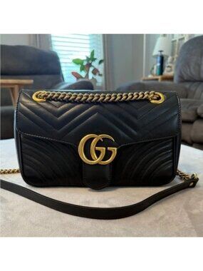 BlackGucci GG Marmont quilted black leather flap bag Gucci Marmont flap bag